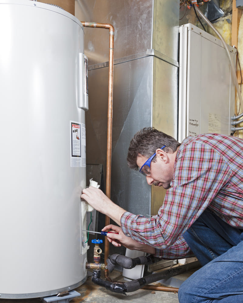 Ehrhardt Brothers plumber performing drain cleaning